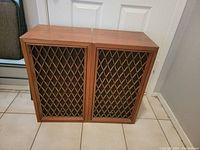 Pair of wooden cabinet vintage Pioneer CS-77 speakers with lattice wood grille covering.