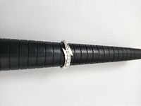 Ring on mandrel showing diamond side profile and setting