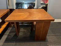 Two teak side tables side by side showing overall lot