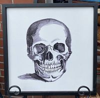 Front view of the framed skull art print showing full skull centered in frame on white background.