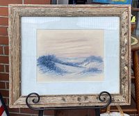 Overview of framed watercolour painting by William Blackman on an easel, showing the rustic recycled barn wood frame with mossy texture.