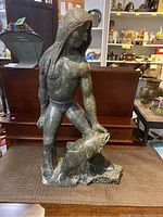 Front view of full statue on table