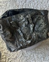 Full view of the vintage Club Monaco XL tote bag showing snakeskin texture and silver hardware on handles.