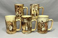 Front view showing the five mugs with detailed Oliver Twist scenes from different angles.
