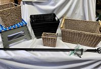 Overview photo showing four woven baskets, curtain rod fully extended and collapsible step stool