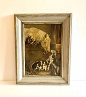 Full view of vintage framed oil painting depicting a mare and colt in stall with a mother dog and three puppies below.