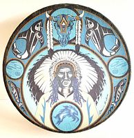 Top view of hand drum with full artwork depicting Native American chief, animal motifs, and buffalo skull