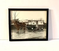 Front view of the black wooden framed vintage black and white photo showing horse and dairy wagon with Avondale Farm Dairy signage.