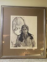 Framed original artwork showing a woman and an oval mirror in black and white with textured lines, mounted under glass in a metallic-finish wooden frame.