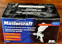 Original Mastercraft spray gun box showing branding, model info, and 0.6L capacity.