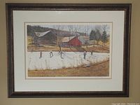 Front view of framed print showing winter skating scene with barns