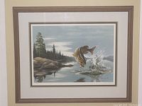 Full view of the framed limited edition print titled 'The Splash - Smallmouth Bass' by Maynard Reece showing a leaping fish in a natural lake setting.