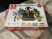 Top view of original Atari Flashback X box showing front artwork and game titles