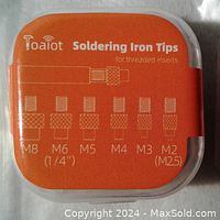 Orange labeled plastic case showing soldering iron tips for threaded inserts sized M8 to M2 (M25 indicated for M2.5).