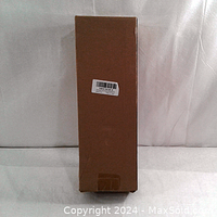 Photo of the brown box packaging of the aluminum can crusher