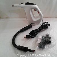 White handheld SXHY steam cleaner with black flexible hose, cord, and accessory kit arranged on white surface.