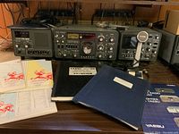 Front view of YR-901, FT-901DM and YO-901 units with manuals and microphone placed in front.