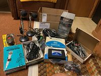 Overview of mics, stands, adaptors, cables and parts drawer tower on floor