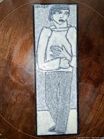 Full view of the enamel plaque showing the entire figure of a man with signature in top left.