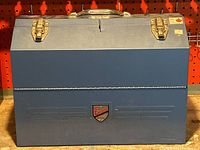 Front view of the large blue Beach Industries tool chest showing the logo, handle, and latches.