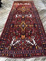 Full view of rug laid flat on wood deck