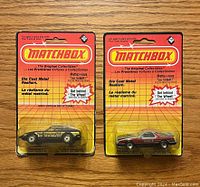 Front view of two sealed Matchbox toy cars in original blister packaging from 1983, showing car models and Matchbox branding
