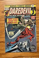 Front cover of Daredevil #116 comic book showing Daredevil fighting a gunman in a dark city environment with text and logos including Marvel Comics Group and issue number.