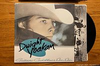 Front cover of Dwight Yoakam vinyl album showing close-up of the artist wearing a cowboy hat with album and artist name.