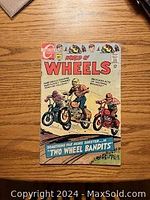 Front cover of World Of Wheels comic book issue #22 showing cartoon characters and title text.