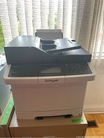 Full view of the Lexmark multifunction printer showing the document feeder, control panel, and general shape.