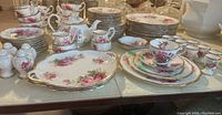 Wide view of full dinnerware lot on table