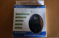 Photo of the boxed anti-lost and theft device with listed features on the front of the package