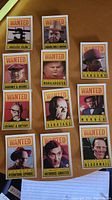 12 'Wanted' poster style Dick Tracy collectible cards arranged on a flat surface