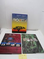 Front covers of all three Canada Post annual stamp collection books for years 1992, 1993, and 1994 shown standing upright.