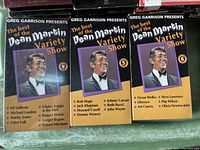 Three VHS tapes of Greg Garrison's Dean Martin Variety Show volumes 5, 6, and 9 with Dean Martin on the covers.