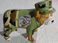 Side angle showing the bulldog figurine in Marine uniform with painted soldier image on side.