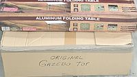 Box labeled 'Original Gazebo Top' and box for an aluminum folding table.