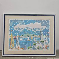 Front view of framed nautical art print showing colorful sailboat harbor scene with clouds and blue sky.