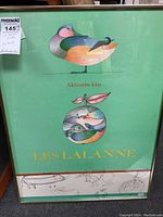 Full front view of the framed poster showing colorful duck and abstract bird designs with text and mint green background.
