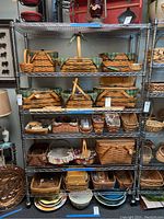 Full front view of 6-tier chrome wire shelving unit loaded with baskets (contents excluded)