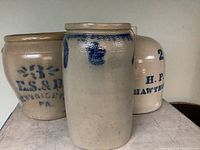 overview of three salt-glazed stoneware items: 3-gal G.S. & Bro crock, plain crock with cobalt decoration, 2-gal H.P. Hawthorne jug