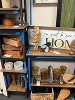 Four stained and painted wood end tables with natural wood tops and bottom shelves. Blue tape tags visible around the edges.