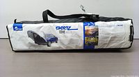 Napier Sportz Cove tent packed in original bag showing product label, model number, and truck fitment details.