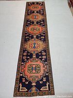 Full length view of the runner on white floor showing multimedallion pattern