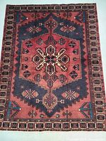 Full front view showing entire rug, central medallion and border pattern