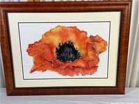 Framed orange poppy flower print, full view showing frame and matting