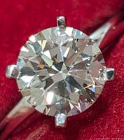 Top-down close-up of round brilliant diamond in six-prong setting