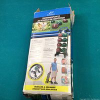 Box showing Eastpoint Tournament Bocce set with explanation of use and rolling cart for organization.