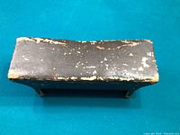 Top view showing curved seat with paint wear and chipping.