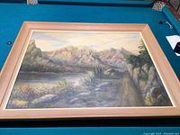 Framed oil painting showing entire mountain scenery artwork